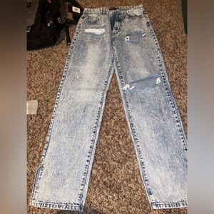 Denim blue jeans, distressed